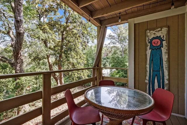 a view of a porch with furniture and a tub