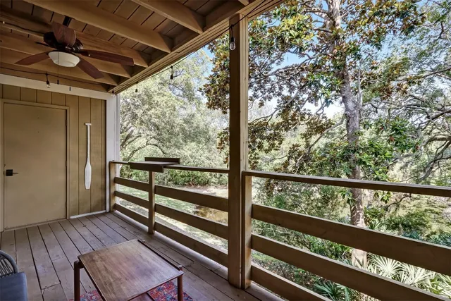 a view of a two room with wooden floor and outdoor seating