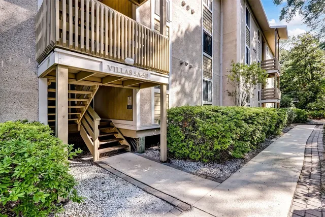 a front view of a building with garden