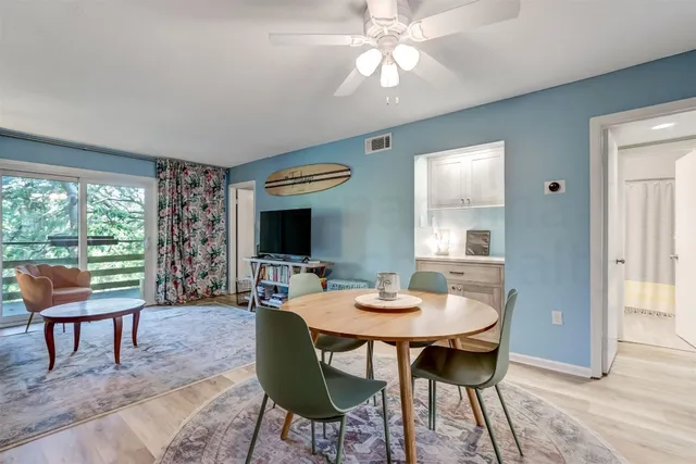 a view of a dining room with furniture window and outside view