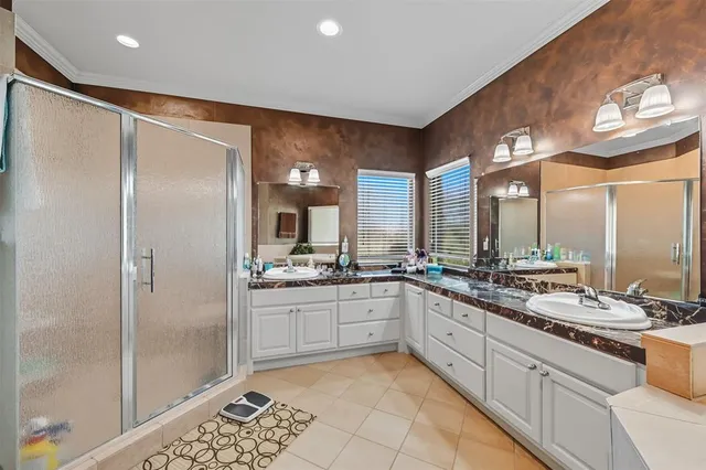 a large kitchen with a large window and stainless steel appliances