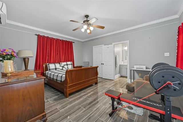 a living room with furniture a rug and a chandelier