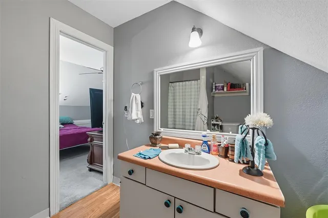 a bathroom with a sink and a mirror