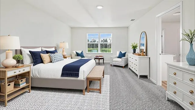 a bedroom with bed and windows