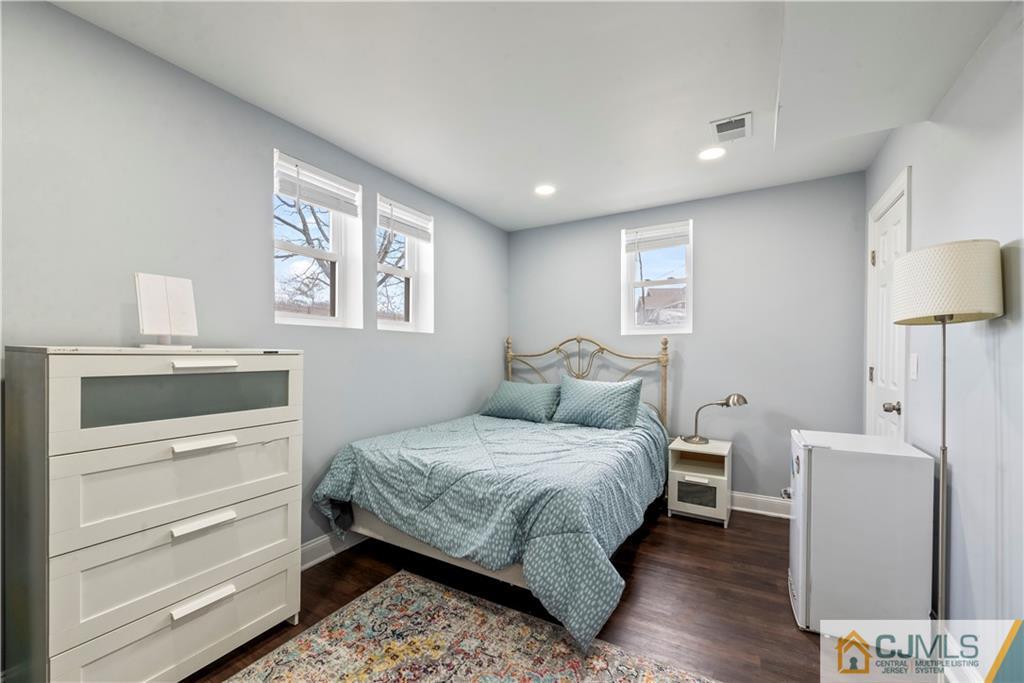 57 Dunhams Corner Road East Brunswick, NJ 08816 - Photo 18 of 31 a bedroom with a bed and a window