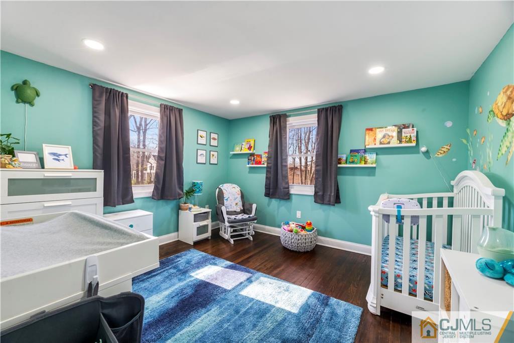 57 Dunhams Corner Road East Brunswick, NJ 08816 - Photo 20 of 31 a living room with furniture and a wooden floor