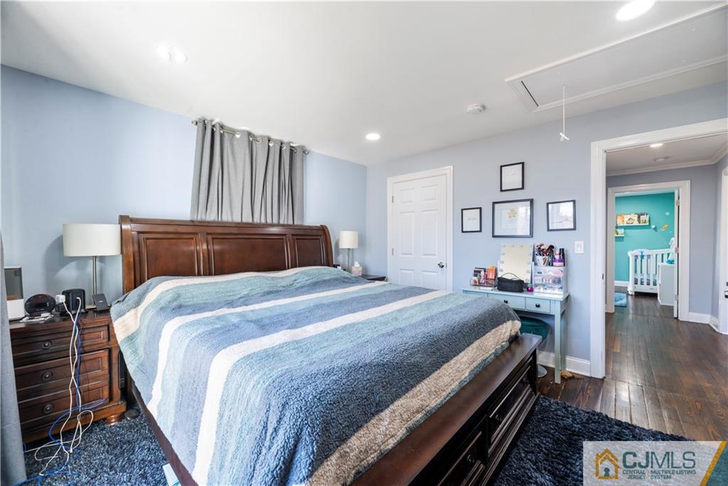 57 Dunhams Corner Road East Brunswick, NJ 08816 - Photo 22 of 31 a bedroom with bed and wooden floor