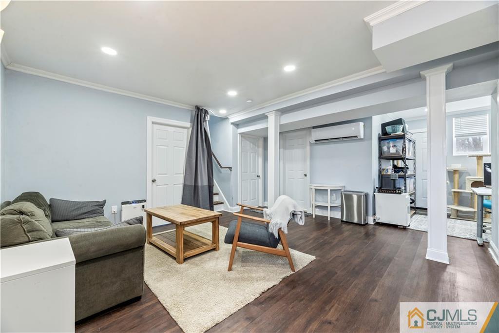 57 Dunhams Corner Road East Brunswick, NJ 08816 - Photo 23 of 31 a living room with furniture and wooden floor