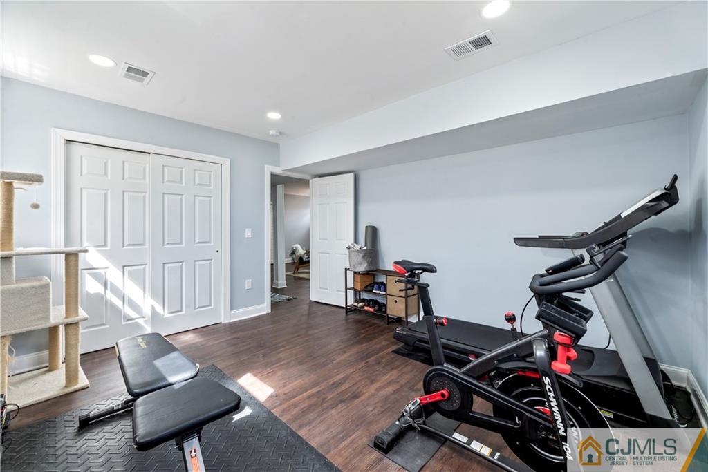 57 Dunhams Corner Road East Brunswick, NJ 08816 - Photo 24 of 31 a view of a room with gym equipment