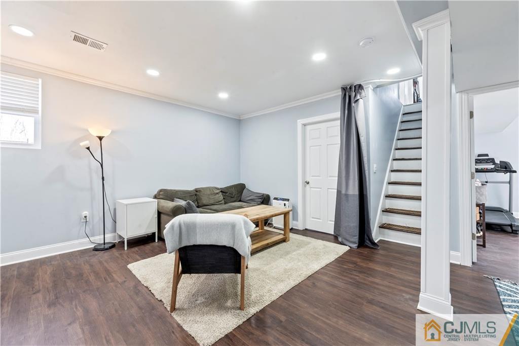 57 Dunhams Corner Road East Brunswick, NJ 08816 - Photo 25 of 31 a living room with furniture and a wooden floor