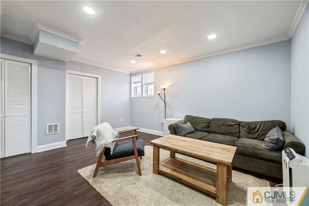 57 Dunhams Corner Road East Brunswick, NJ 08816 - Photo 26 of 31 a living room with furniture and a wooden floor