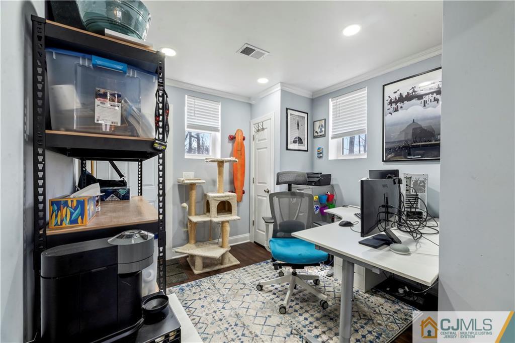 57 Dunhams Corner Road East Brunswick, NJ 08816 - Photo 28 of 31 a living room with furniture and a flat screen tv
