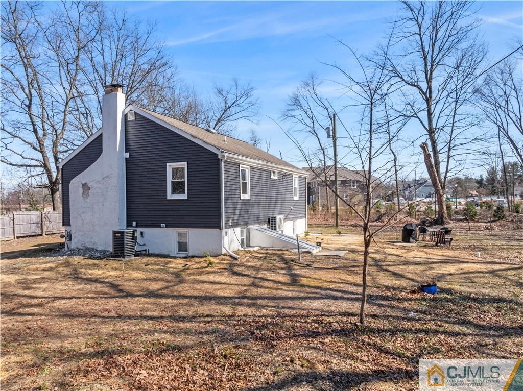 57 Dunhams Corner Road East Brunswick, NJ 08816 - Photo 29 of 31 a view of a yard covered with snow