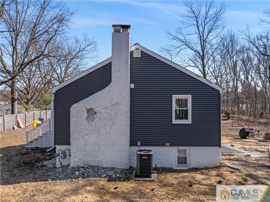57 Dunhams Corner Road East Brunswick, NJ 08816 - Photo 30 of 31 a view of a house with a yard