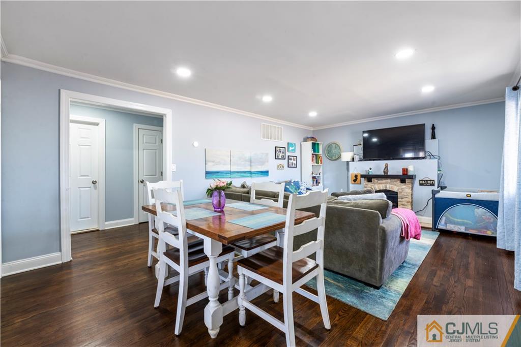 57 Dunhams Corner Road East Brunswick, NJ 08816 - Photo 9 of 31 a view of a dining room with furniture and wooden floor