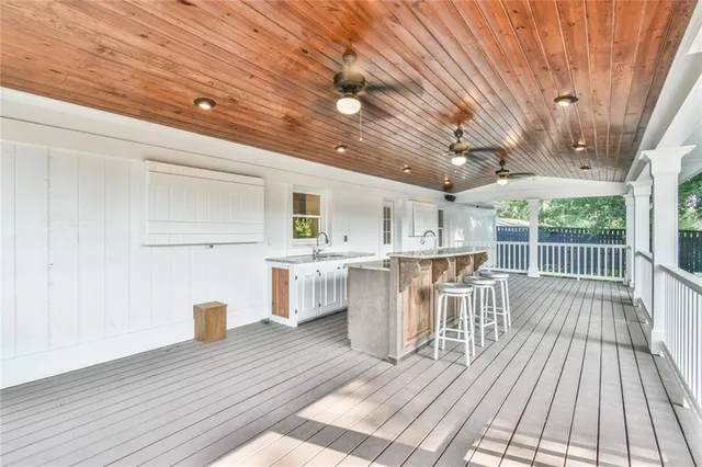 a view of a house with swimming pool and a yard