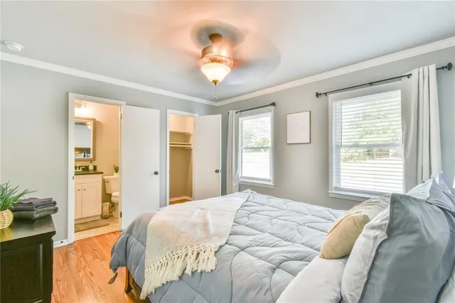 a living room with furniture couches and a flat screen tv