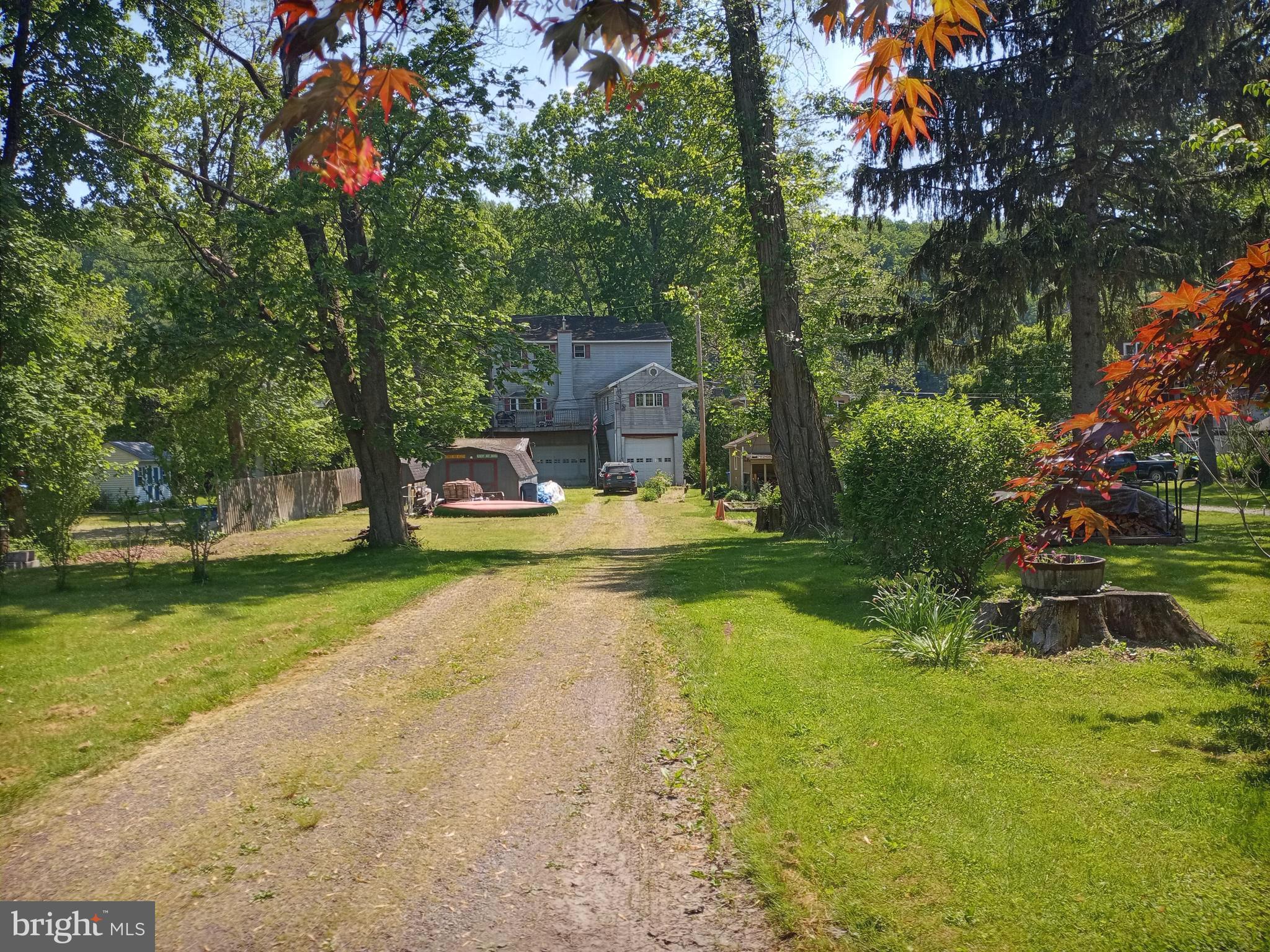 159 Byram Lane Stockton, NJ 08559 - Photo 25 of 41 Back Exterior of House Down Driveway