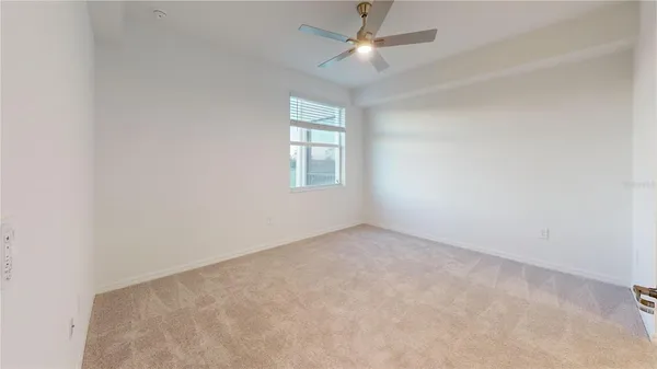 a view of a kitchen and kitchen with stainless steel appliances granite countertop cabinets