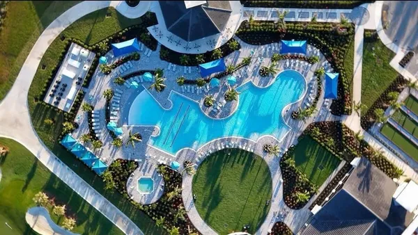 a view of a room with gym equipment and a large window