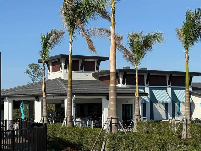 a view of house with garden and deck