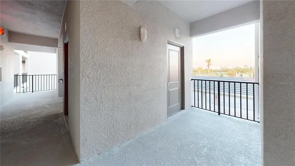 a view of an empty room and closet area