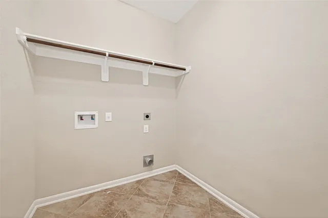 an empty room with windows and entryway