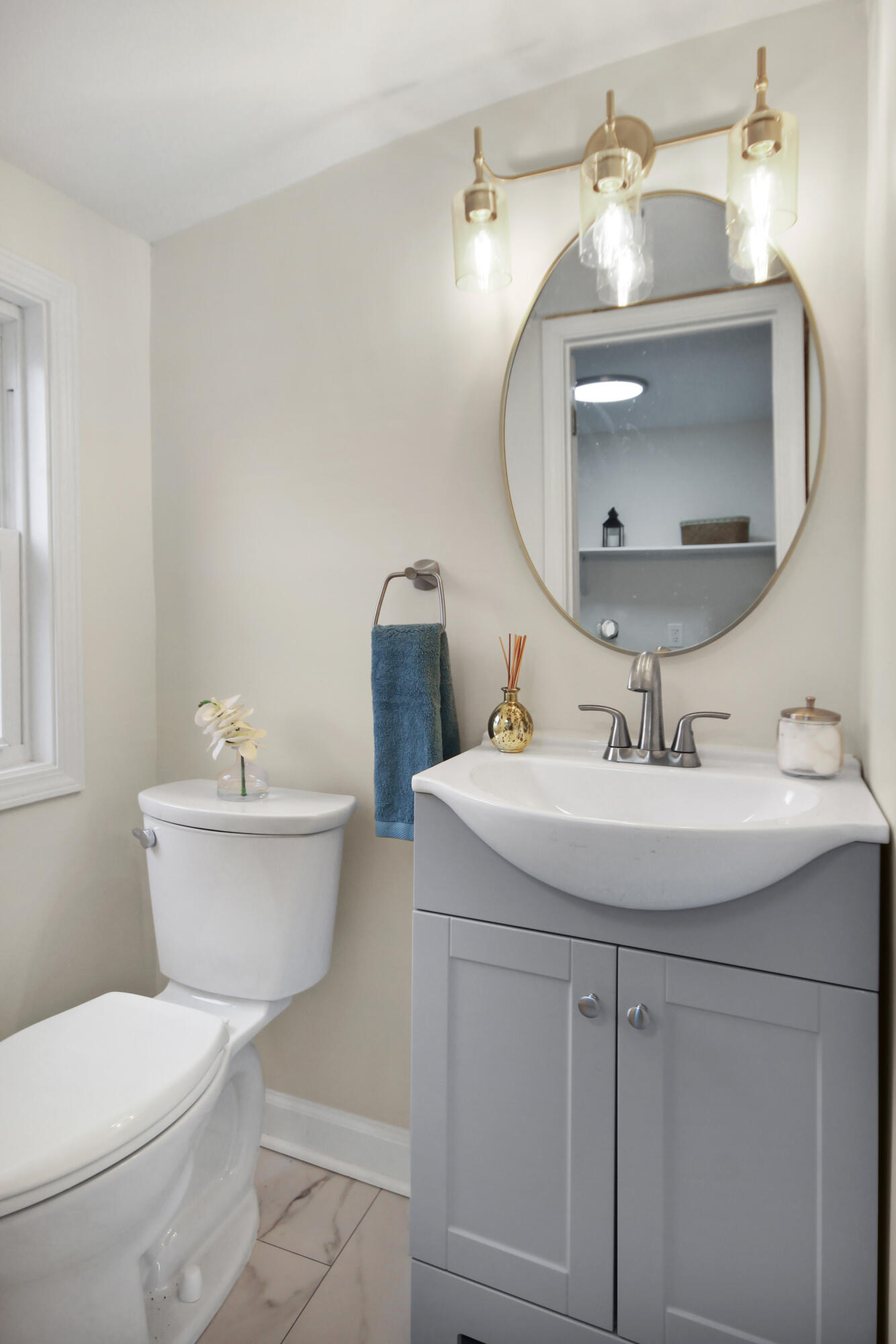 405 Institute Street Valparaiso, IN 46383 - Photo 11 of 17 a bathroom with a toilet a sink and mirror