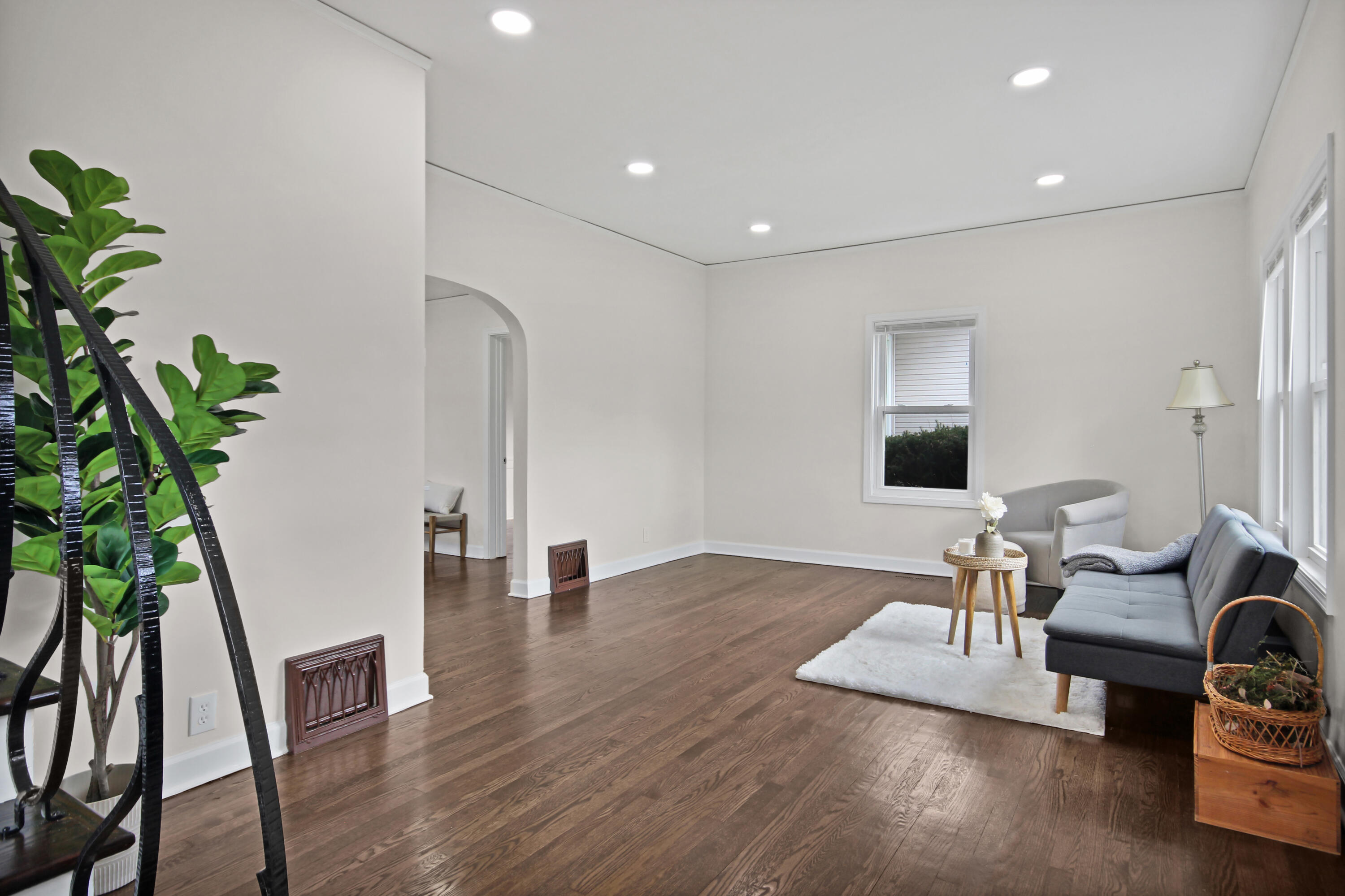 405 Institute Street Valparaiso, IN 46383 - Photo 2 of 17 a living room with furniture and a potted plant