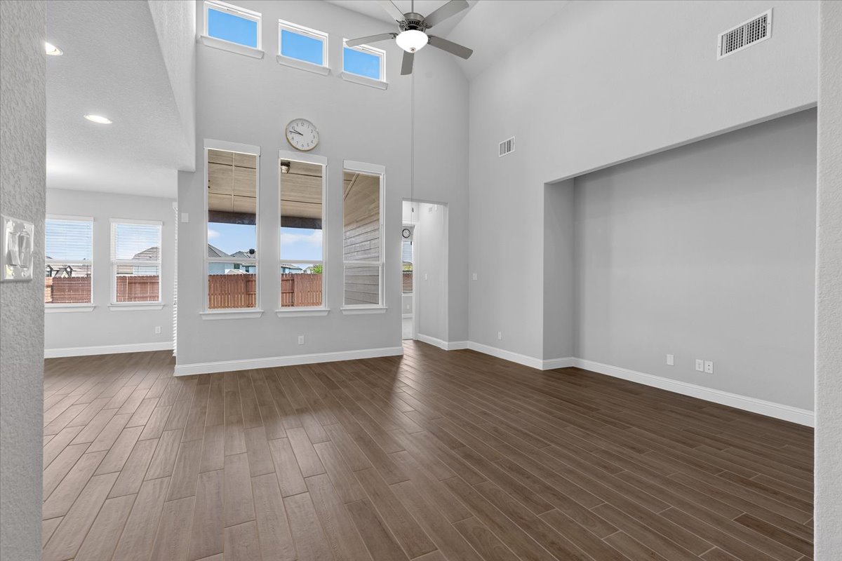 109 Rocky River Road Georgetown, TX 78628 - Photo 15 of 37 High ceilings and abundant natural light create an open and airy ambiance in this well-appointed living space.