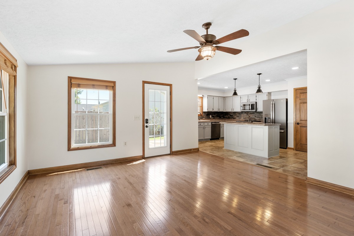 526 Calista Road White House, TN 37188 - Photo 12 of 29 a view of a kitchen with a sink wooden floor and a window