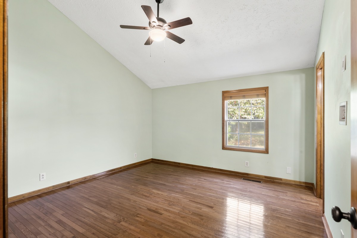 526 Calista Road White House, TN 37188 - Photo 13 of 29 a view of empty room with wooden floor and fan