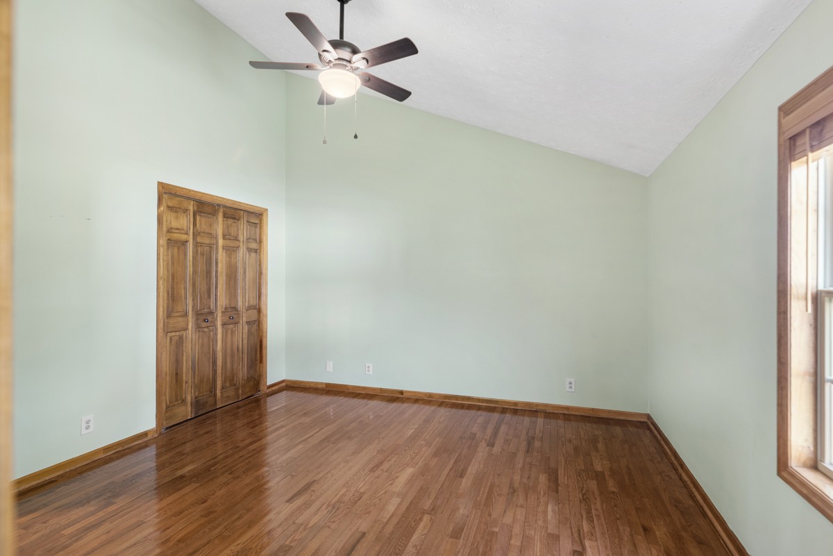 526 Calista Road White House, TN 37188 - Photo 14 of 29 an empty room with wooden floor and windows