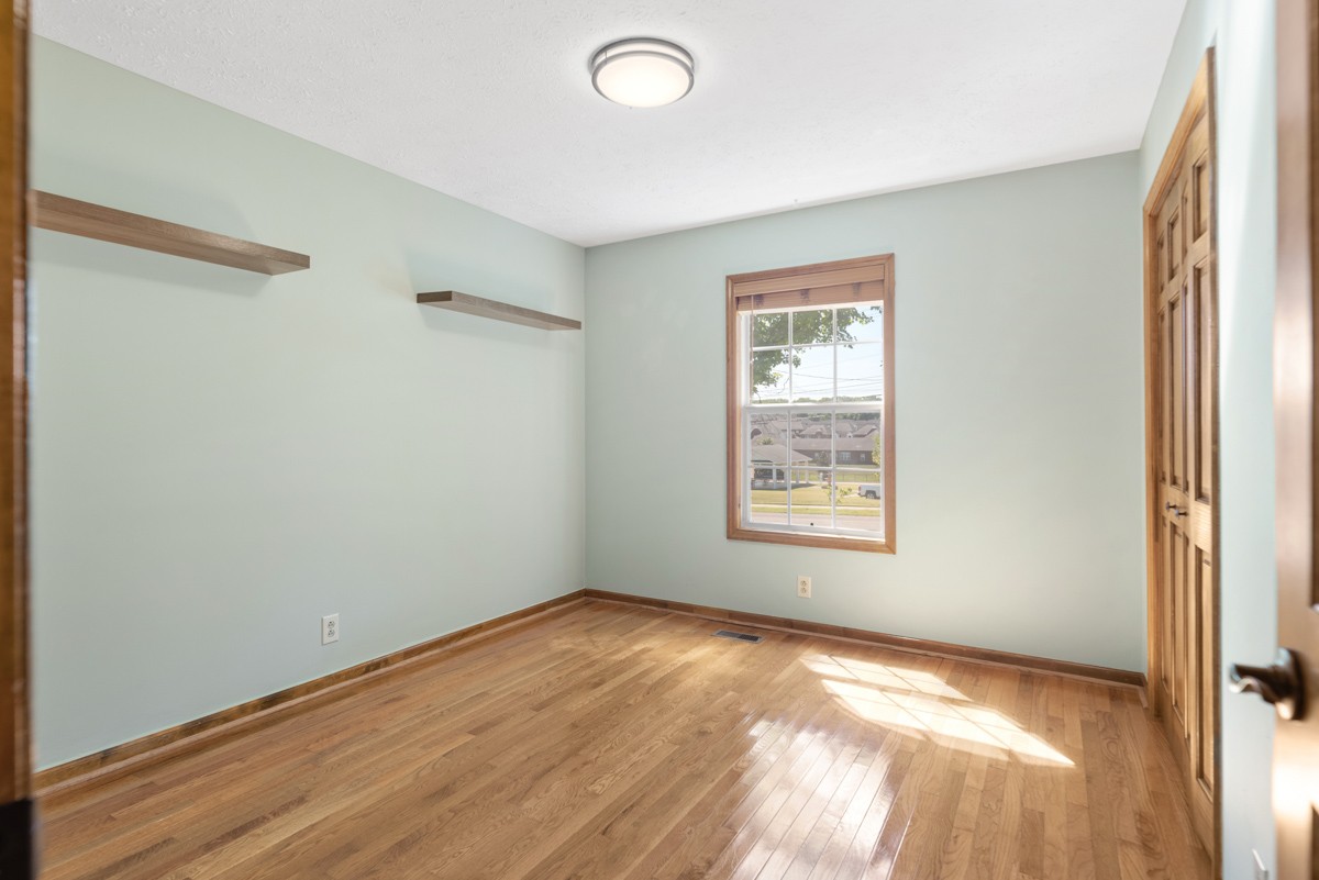 526 Calista Road White House, TN 37188 - Photo 16 of 29 a view of an empty room with wooden floor and a window
