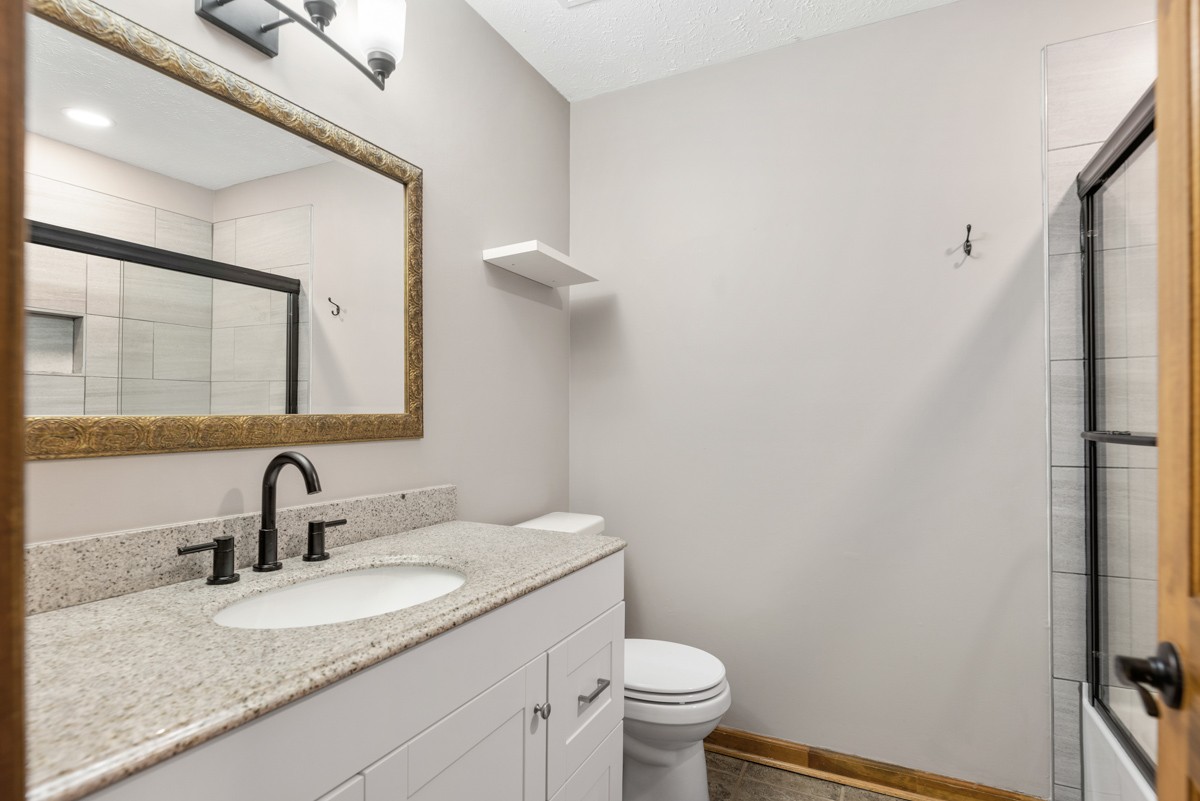 526 Calista Road White House, TN 37188 - Photo 18 of 29 a bathroom with a toilet sink and mirror