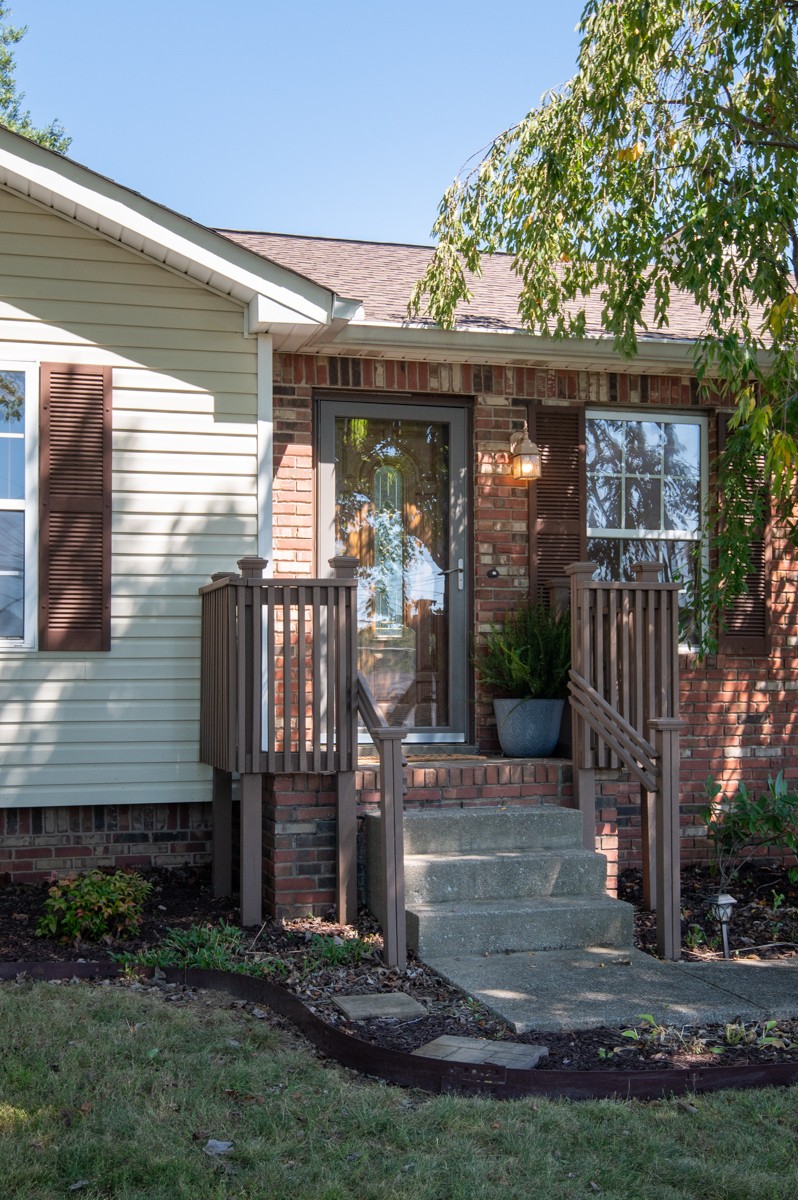 526 Calista Road White House, TN 37188 - Photo 2 of 29 a view of a porch with a table and chairs under an umbrella