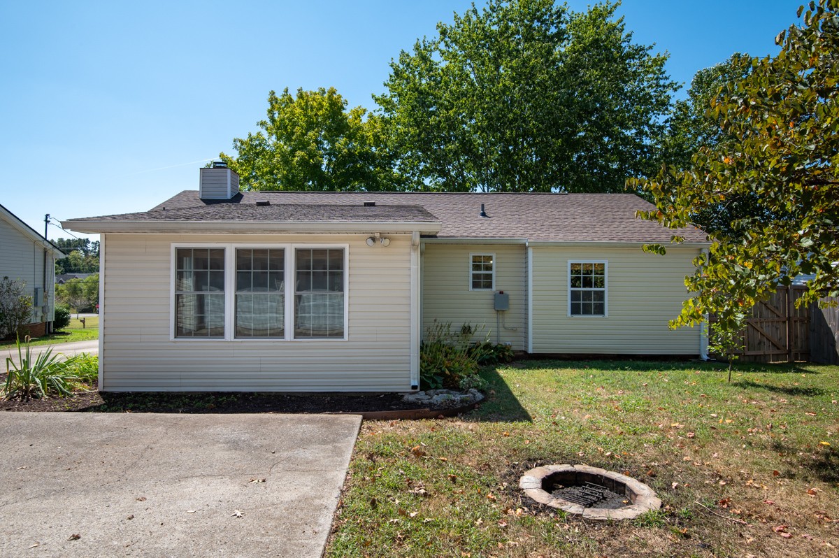 526 Calista Road White House, TN 37188 - Photo 22 of 29 a view of a house with backyard tub and trees