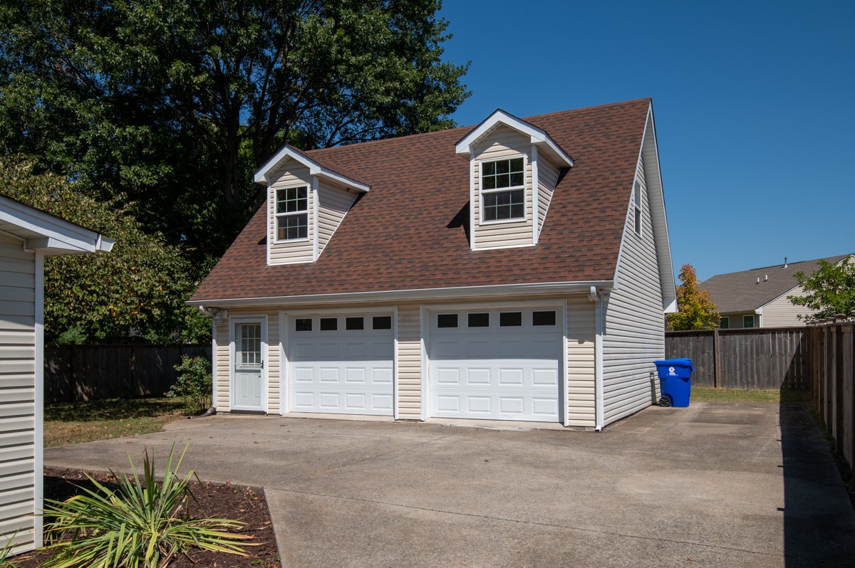 526 Calista Road White House, TN 37188 - Photo 23 of 29 a front view of a house with a yard and garage