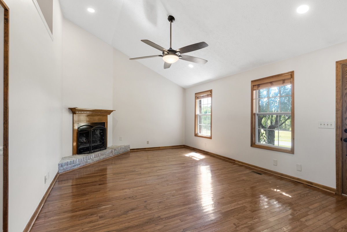 526 Calista Road White House, TN 37188 - Photo 4 of 29 an empty room with windows and fireplace