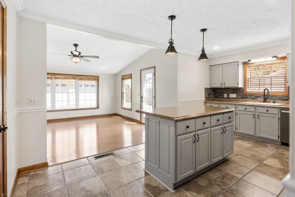 526 Calista Road White House, TN 37188 - Photo 10 of 29 a kitchen with granite countertop white cabinets and white appliances