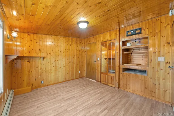 a view of a bathroom with wooden floor