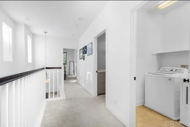 a large white bed in a white room