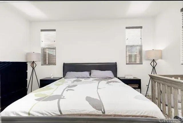 a bathroom with a sink double vanity granite tub shower and a mirror