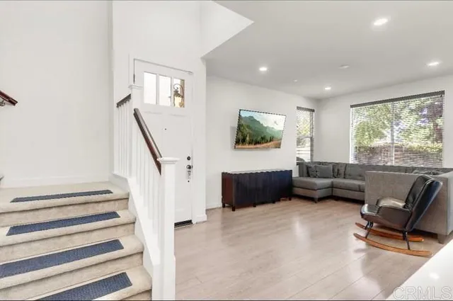 a view of a utility room with closet and windows