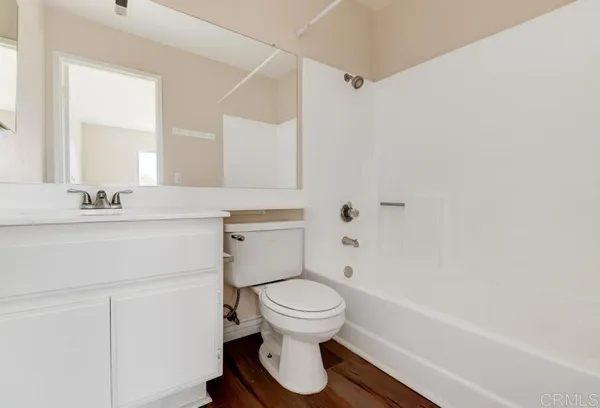a bathroom with a sink a toilet and a bathtub
