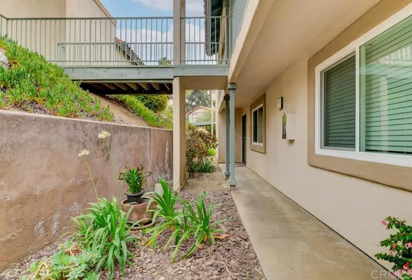 a view of a house with a small yard