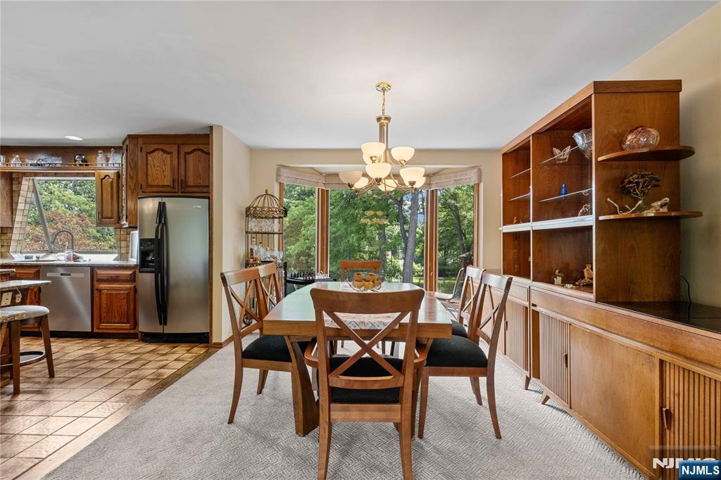 1468 Alps Road Wayne, NJ 07470 - Photo 8 of 36 a view of a dining room with furniture window and outside view