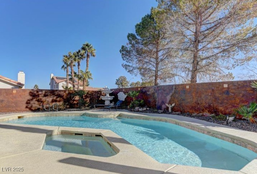 356 Amalfi Street Henderson, NV 89074 - Photo 13 of 15 View of swimming pool with a fenced backyard, a patio, and a pool with connected hot tub