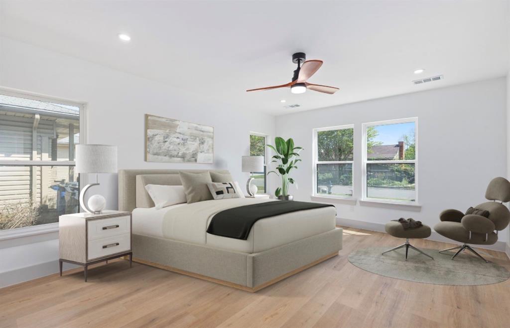 4927 Linnet Lane Dallas, TX 75209 - Photo 12 of 17 a bedroom with a bed and wooden floor