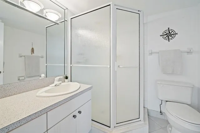 a bedroom with a bed and a table